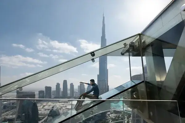 Man pointing at skyscraper backdrop
